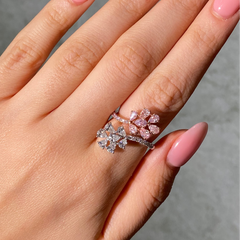 pink and white diamond ring on female hand 