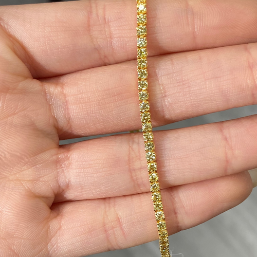 Fancy round shaped intense yellow diamond tennis bracelet, GIA certified with VS clarity.