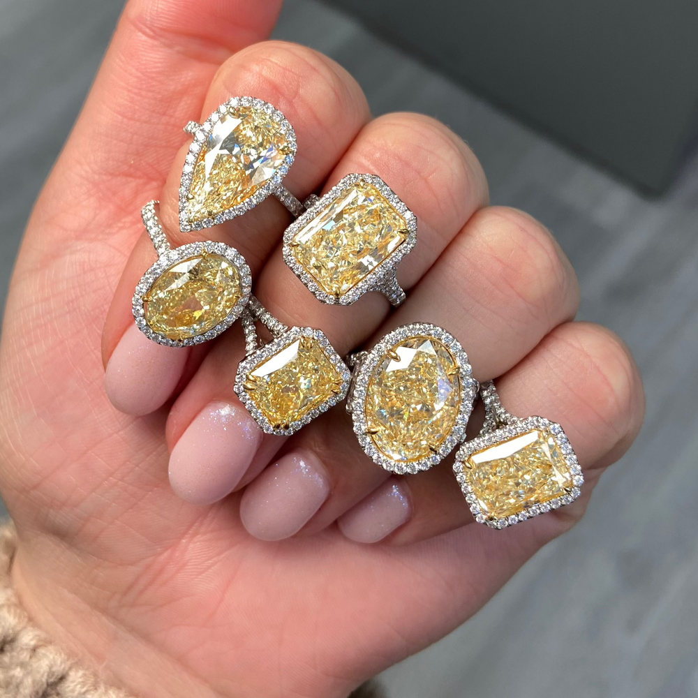 Yellow Oval Diamond Halo Ring with a handcrafted setting and GIA certified side diamonds.