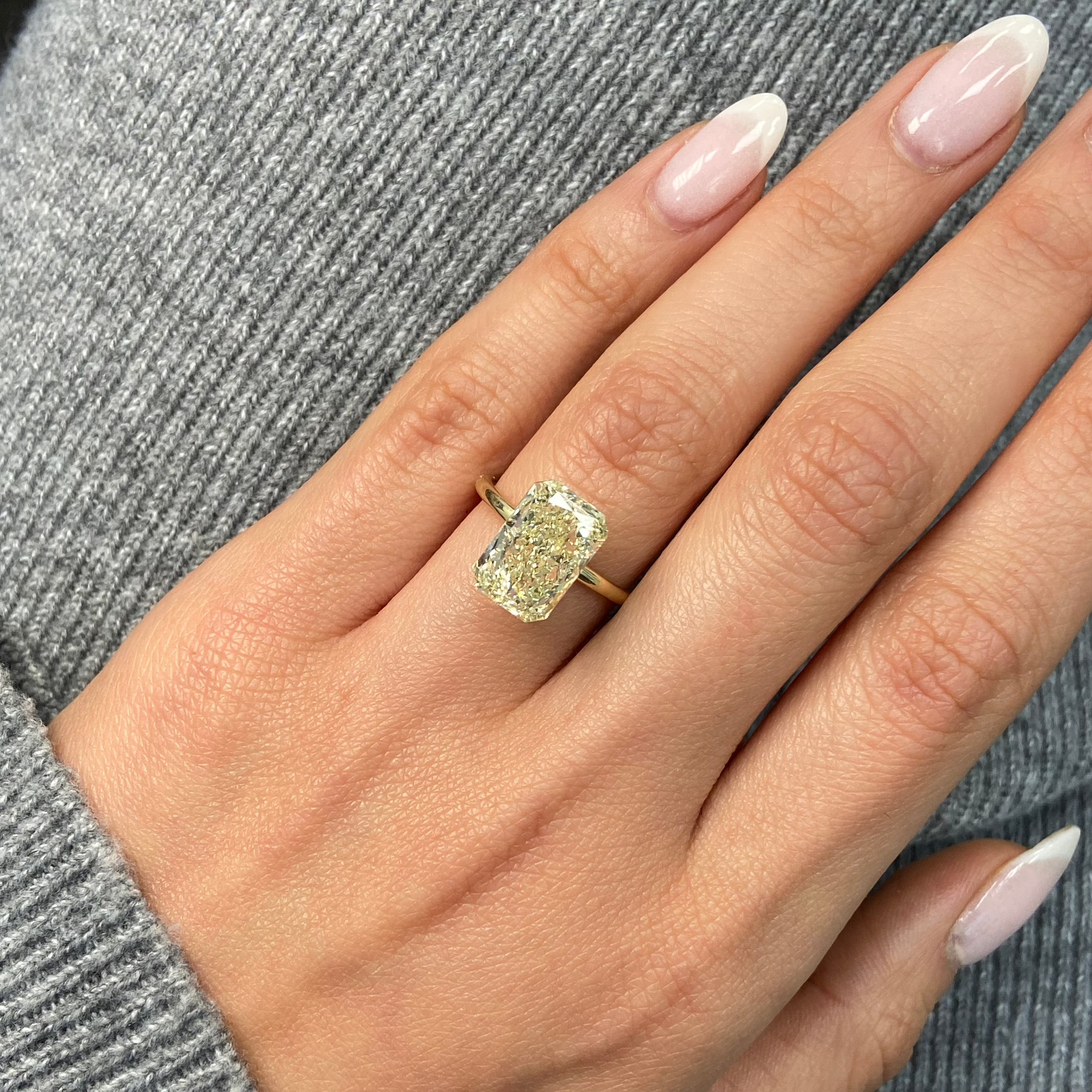 Light yellow radiant cut diamond with VS1 clarity, excellent cut, GIA certified.