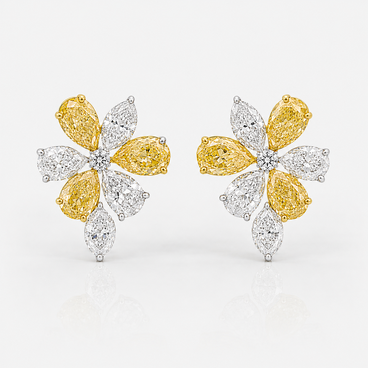 Fancy yellow and colorless pear diamond flower stud earrings in 18k gold | Rare Colors by Namdar, NYC