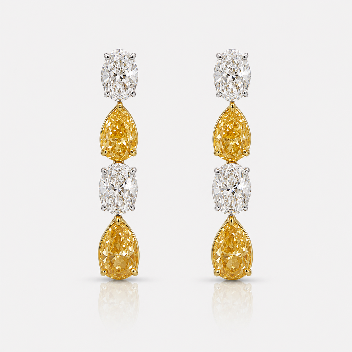 2.3ct fancy yellow pear and colorless oval diamond dangle earrings | Rare Colors by Namdar, NYC