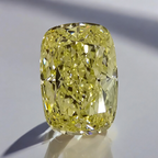 Elegant light yellow elongated cushion-cut diamond with exceptional clarity.