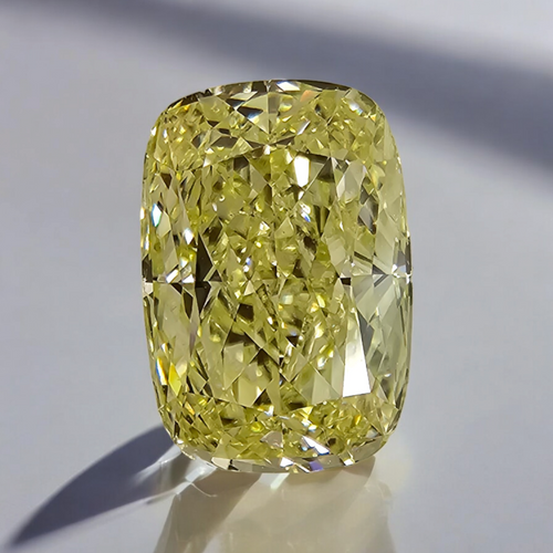 Elegant light yellow elongated cushion-cut diamond with exceptional clarity.