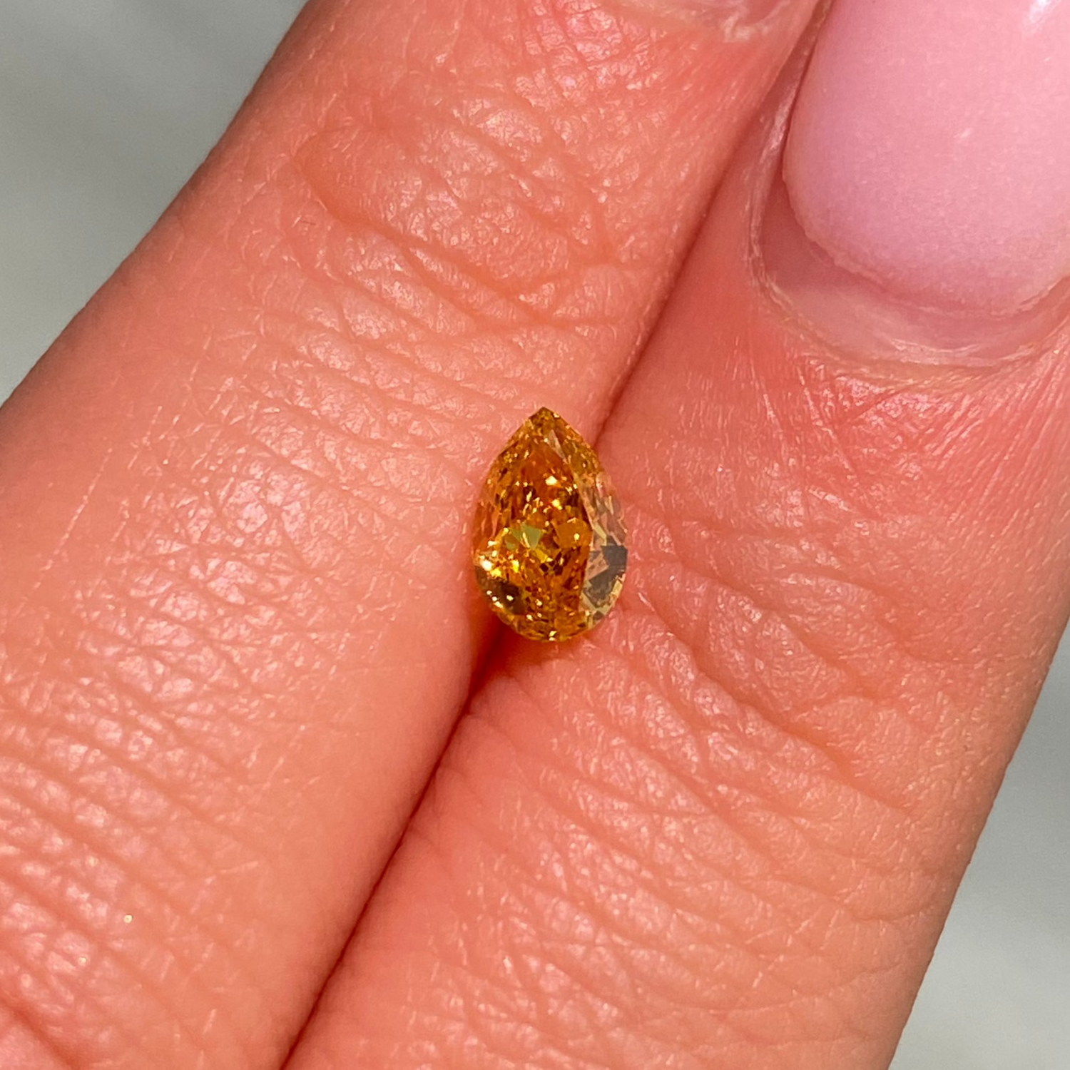 GIA 50ct Fancy Vivid Yellow Pear diamond loose stone at Rare Colors by Namdar, 5th Avenue New York