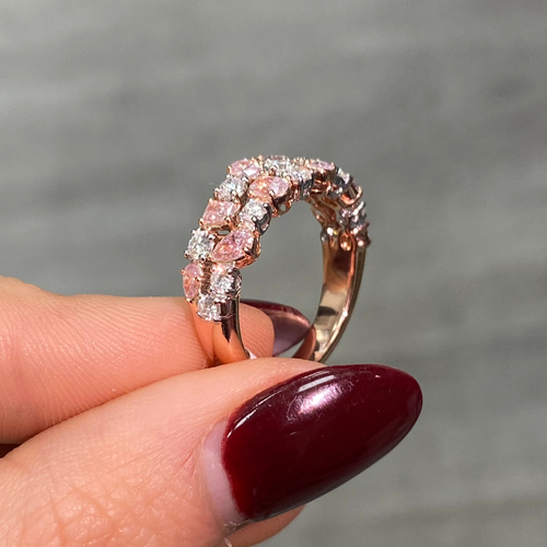 Fine pink and white diamond ring with mixed cuts, offering elegance and a unique design.