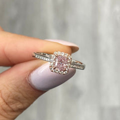 Pink diamond ring. pink diamond engagement ring. light pink diamonds. light pink cushions. diamond ring.