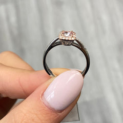 Pink diamond ring. pink diamond engagement ring. light pink diamonds. light pink cushions. diamond ring.