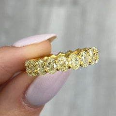 Oval diamond eternity ring. Yellow diamond oval eternity ring. Yellow diamond band. Canary diamond band. Yellow oval diamonds. Fancy yellow oval diamond ring. Yellow diamond stackable rings.