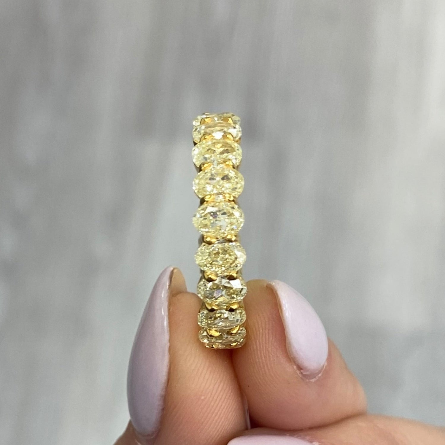 Fancy Yellow Oval diamond eternity band by Rare Colors by Namdar, New York City