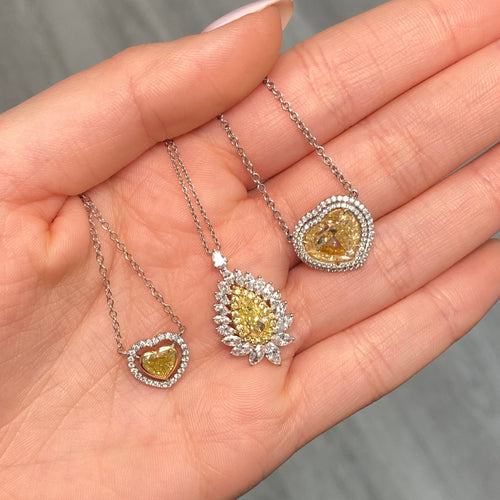 Intense yellow pear shape. Gia certified intense yellow diamond. Yellow diamond necklace. Unique yellow diamond necklace. Yellow diamond pear shape necklace.
