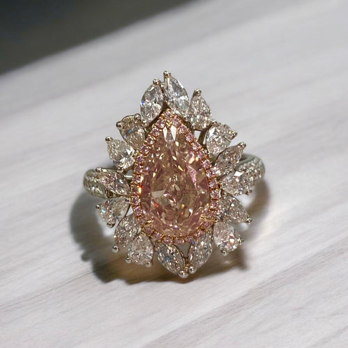 Unique peach color diamond ring, pear shaped, GIA certified. 