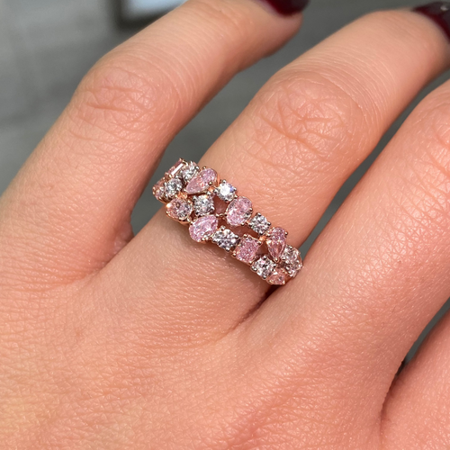 Fine pink and white diamond ring with mixed cuts, offering elegance and a unique design.