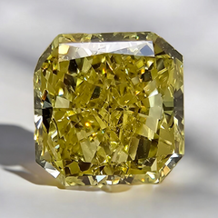 GIA certified elongated radiant cut natural yellow diamond with a unique and vibrant hue.