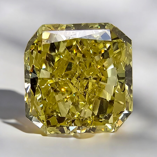 GIA certified elongated radiant cut natural yellow diamond with a unique and vibrant hue.