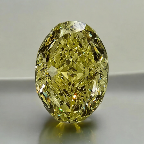 Fancy yellow oval cut diamond with excellent clarity and precision, GIA certified.