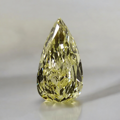 Pear shaped diamond with a fancy light yellow hue, GIA certified, featuring VS2 clarity.
