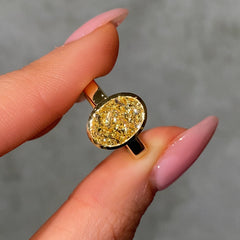 yellow diamond gold bezel ring balck background