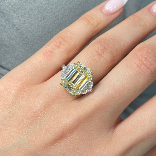 Yellow emerald cut diamond ring with exceptional brilliance, excellent cutting, and VS2 clarity.