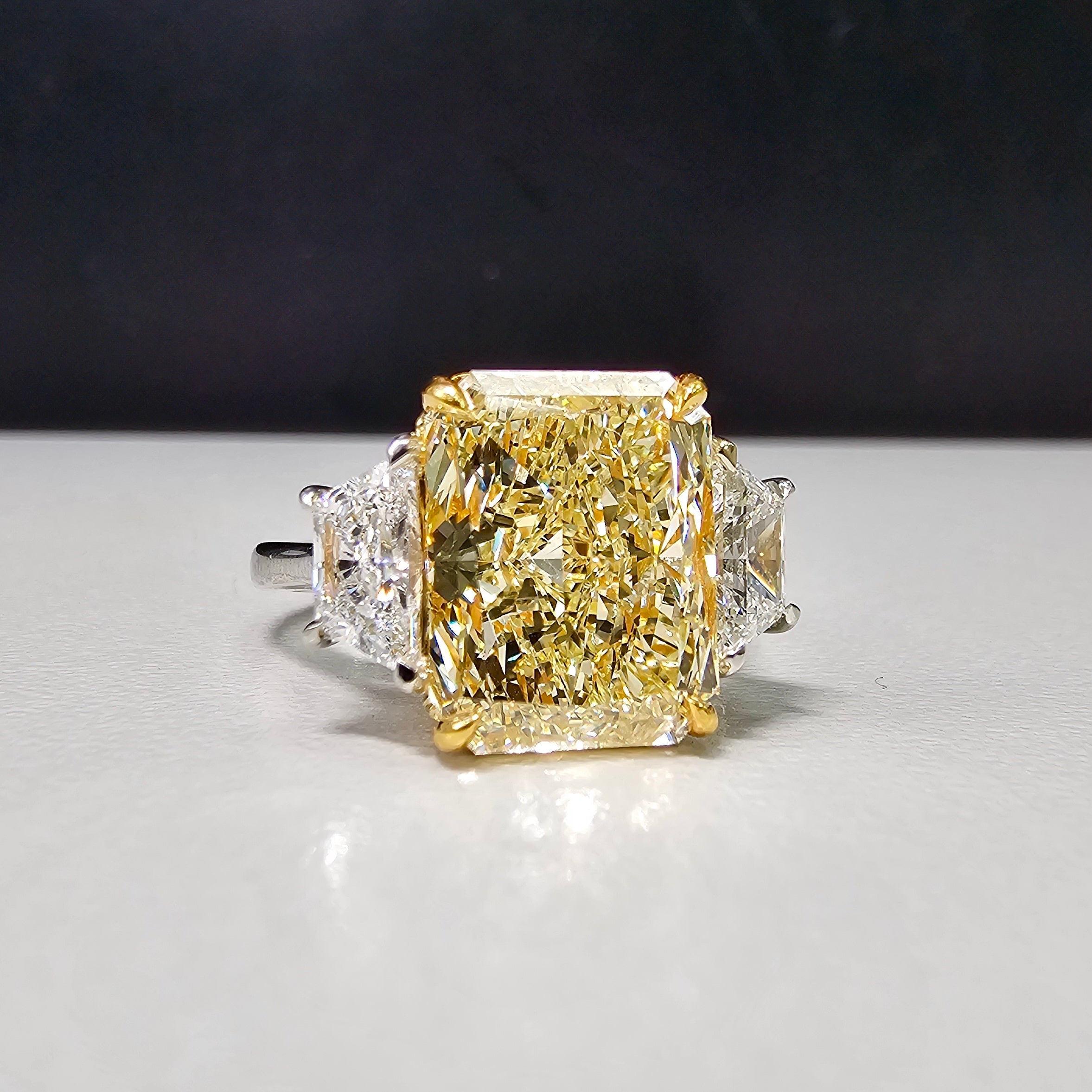 5.34 Carat Fancy Light Yellow Radiant Three Stone Diamond Ring