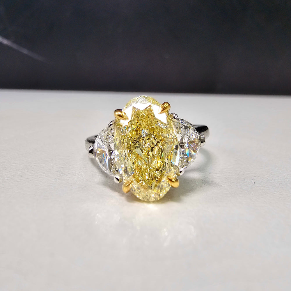 3ct Fancy Light Yellow Oval Three Stone Diamond Ring, a canary oval diamond!