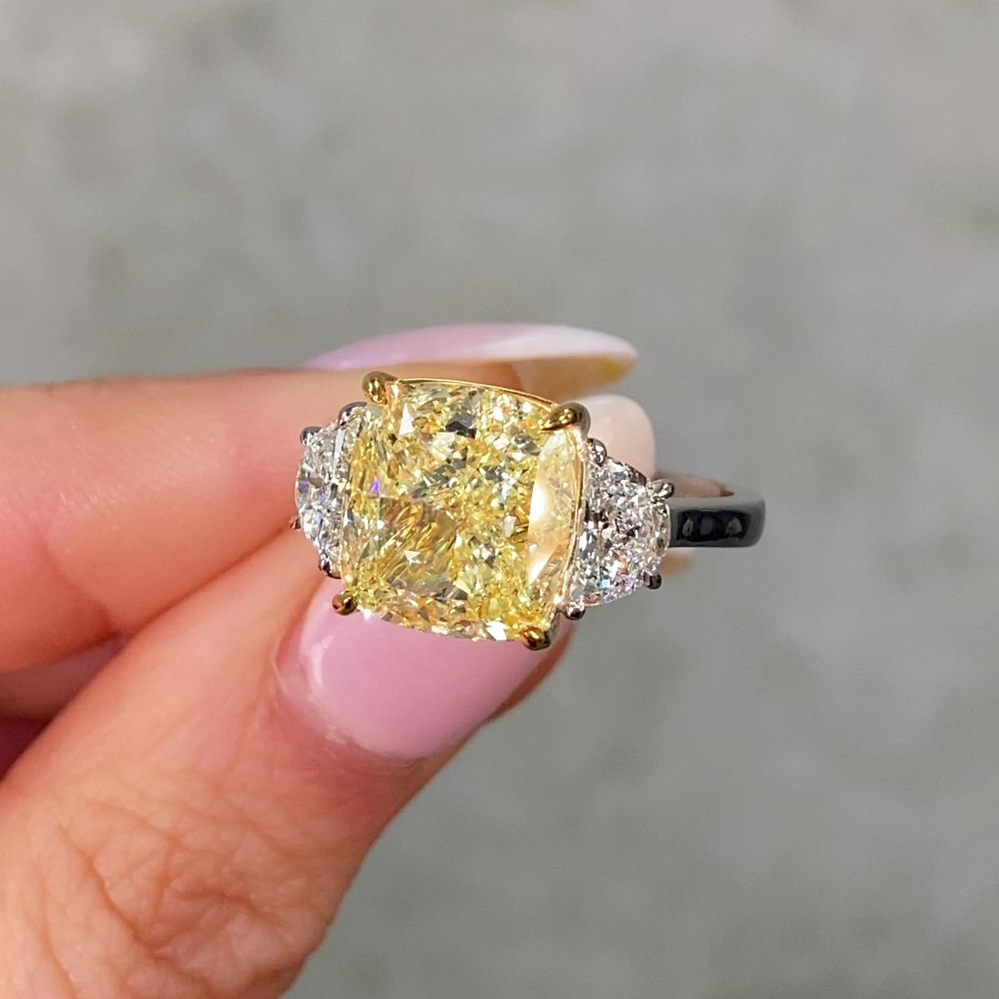 Video of 7 carat yellow diamond ring with two white diamonds 