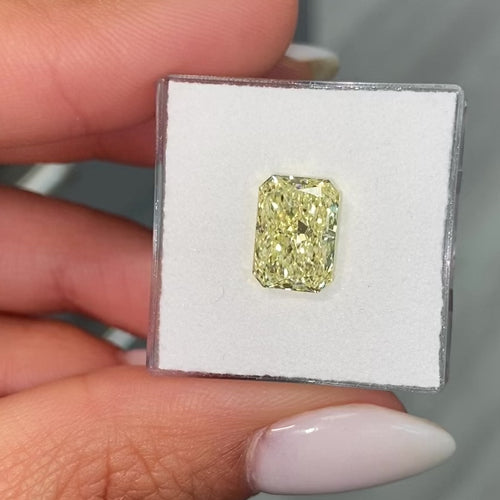Elongated radiant yellow diamond, fancy light yellow natural diamond, natural canary diamond.