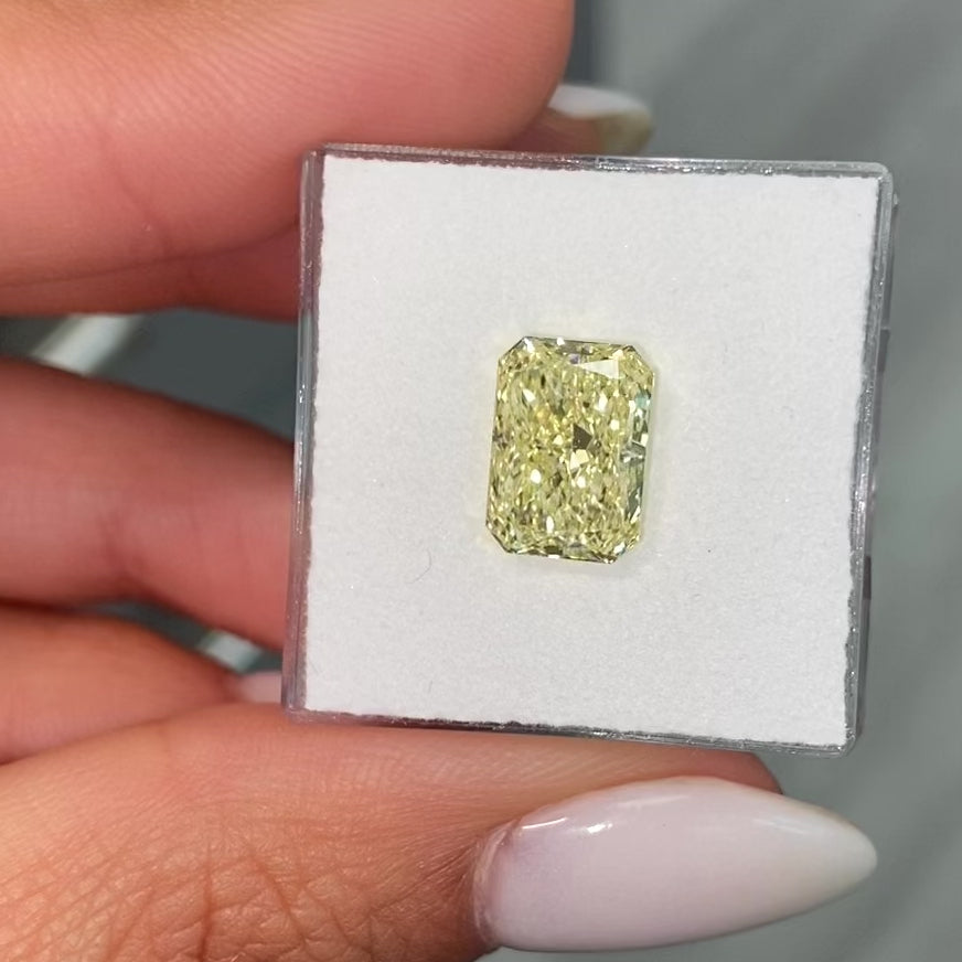 Elongated radiant yellow diamond, fancy light yellow natural diamond, natural canary diamond.