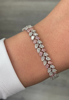 Fancy pink and white pear shape diamond double row bracelet with VS-SI clarity.