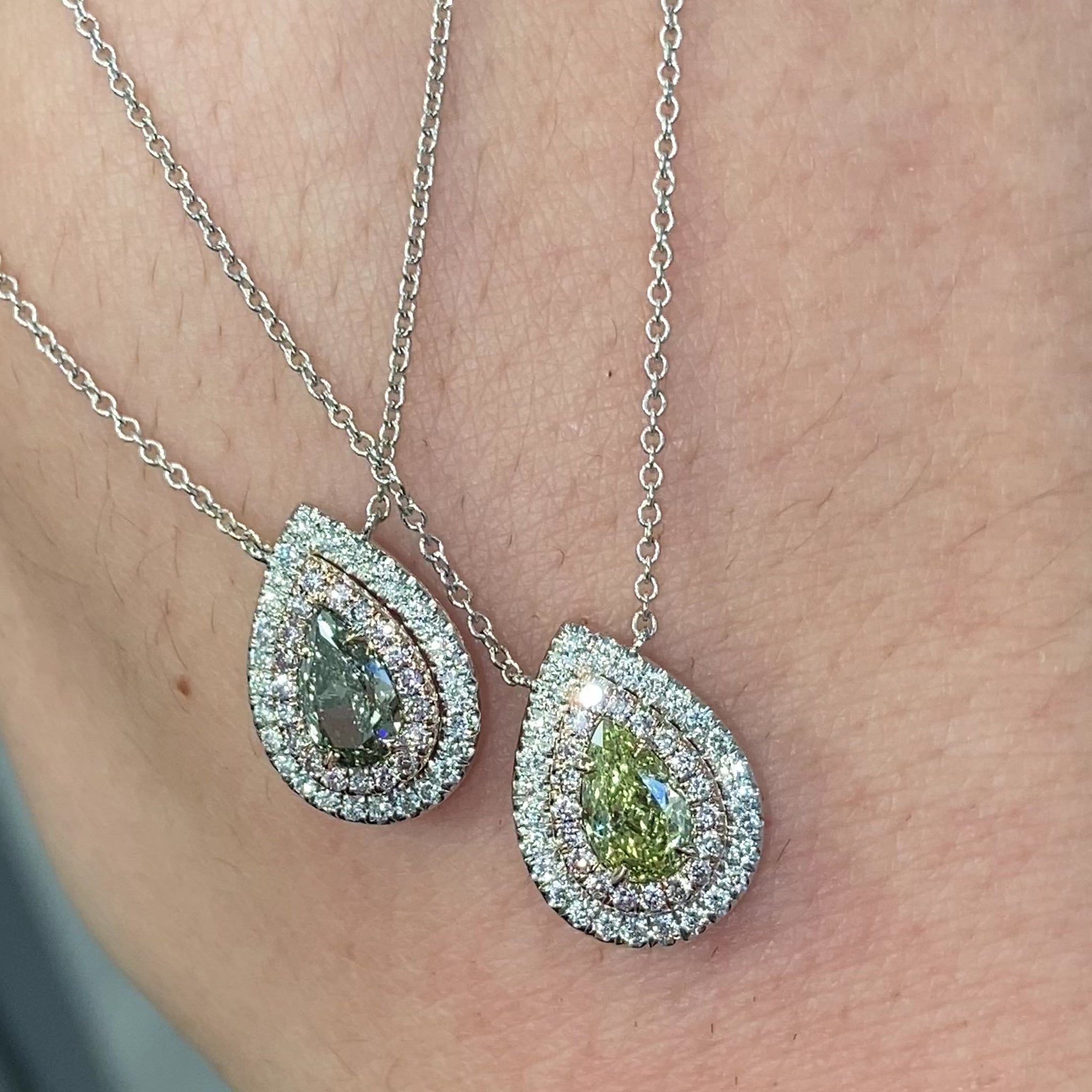 Unique green chameleon pear-shaped diamond pendant with double halo and VS1 clarity center diamond.
