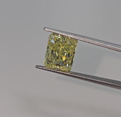 GIA certified Fancy Yellow marquise cut diamond with VS1 clarity and no fluorescence.