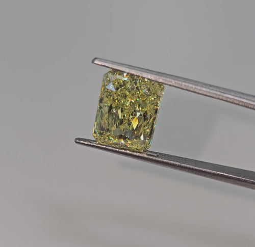 GIA certified Fancy Yellow marquise cut diamond with VS1 clarity and no fluorescence.