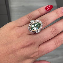 Unique green marquise cut diamond ring featuring a GIA certified diamond.