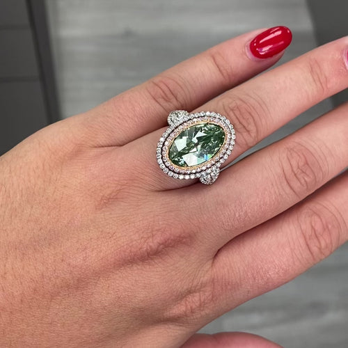 Unique green marquise cut diamond ring featuring a GIA certified diamond.
