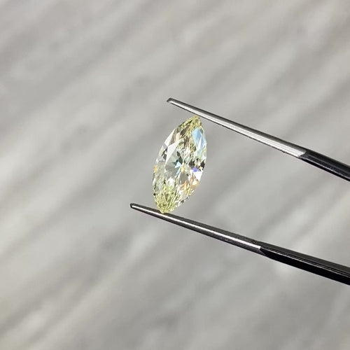 Fancy Yellow marquise cut diamond with VS1 clarity and no fluorescence.