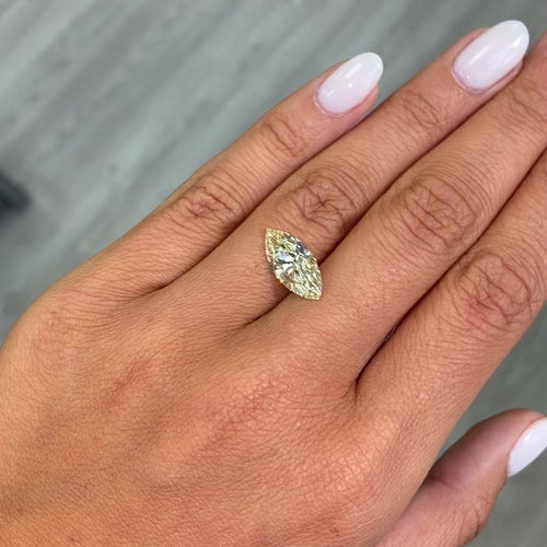 Fancy Yellow marquise cut diamond with VS1 clarity and no fluorescence.
