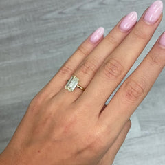 Unique elongated light yellow emerald cut diamond, GIA certified with excellent clarity.