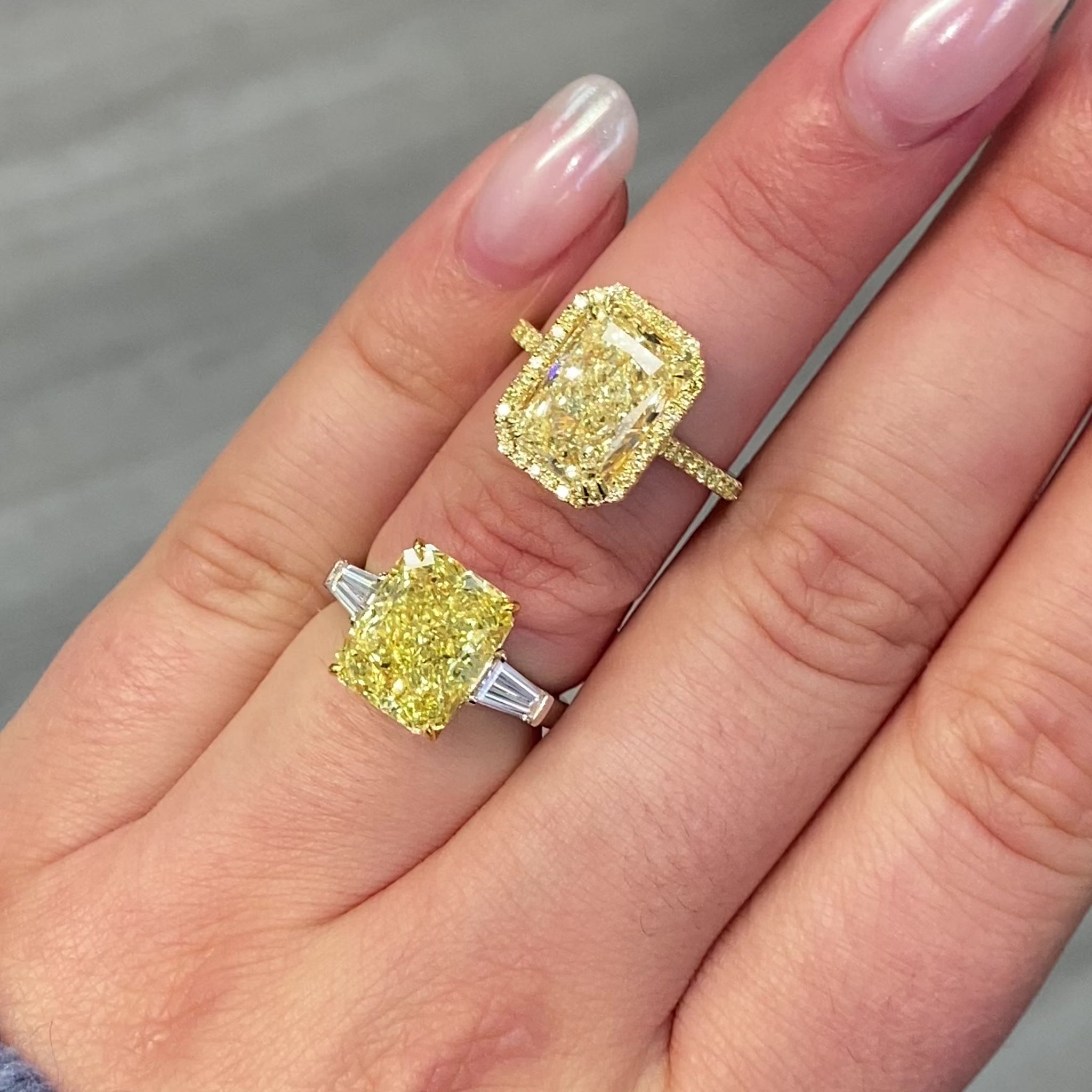 Old money yellow halo diamond engagement ring featuring a GIA certified light yellow elongated radiant diamond with VS2 clarity.
