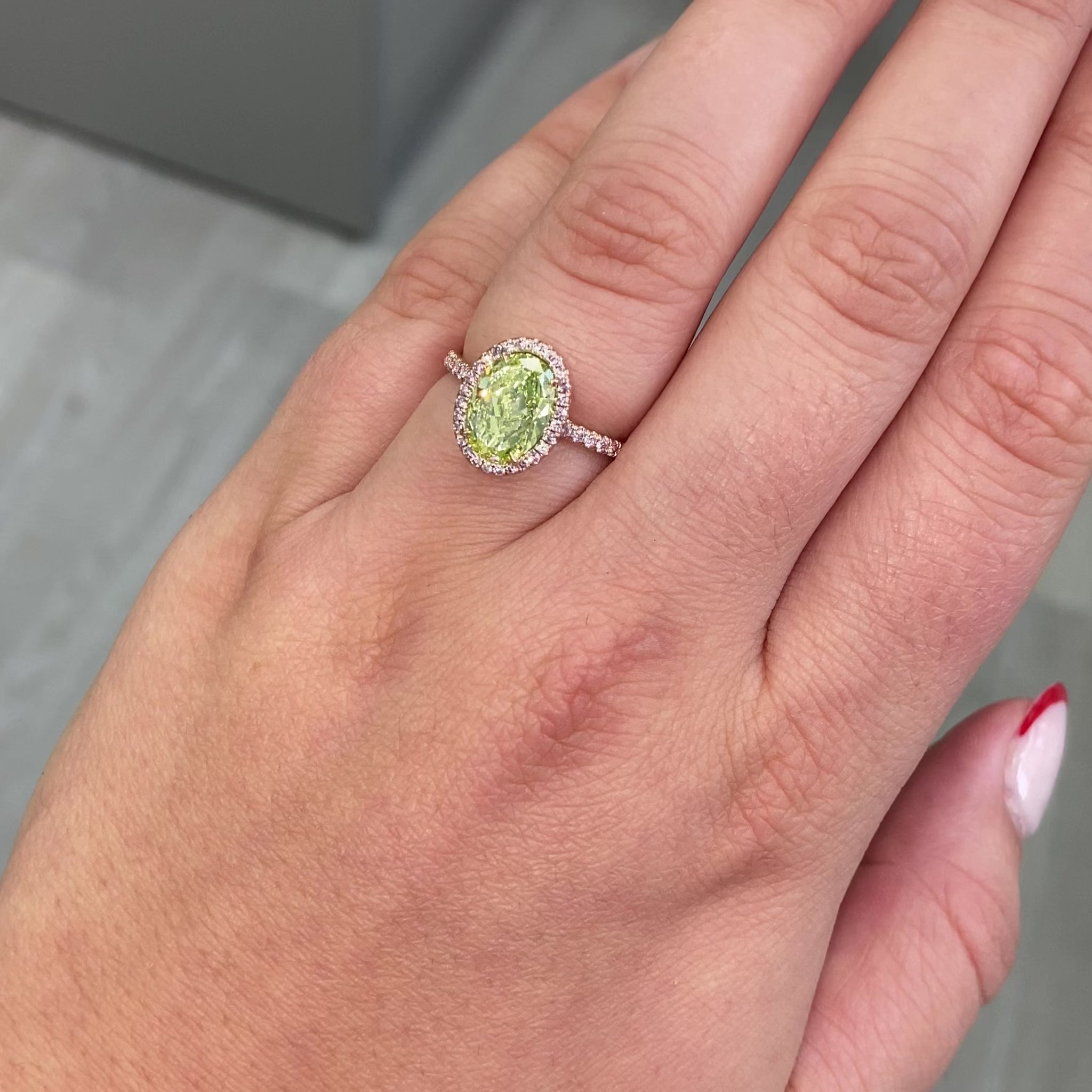 oval cut diamond, natural green diamond, unique green diamond engagement ring in pink diamond halo