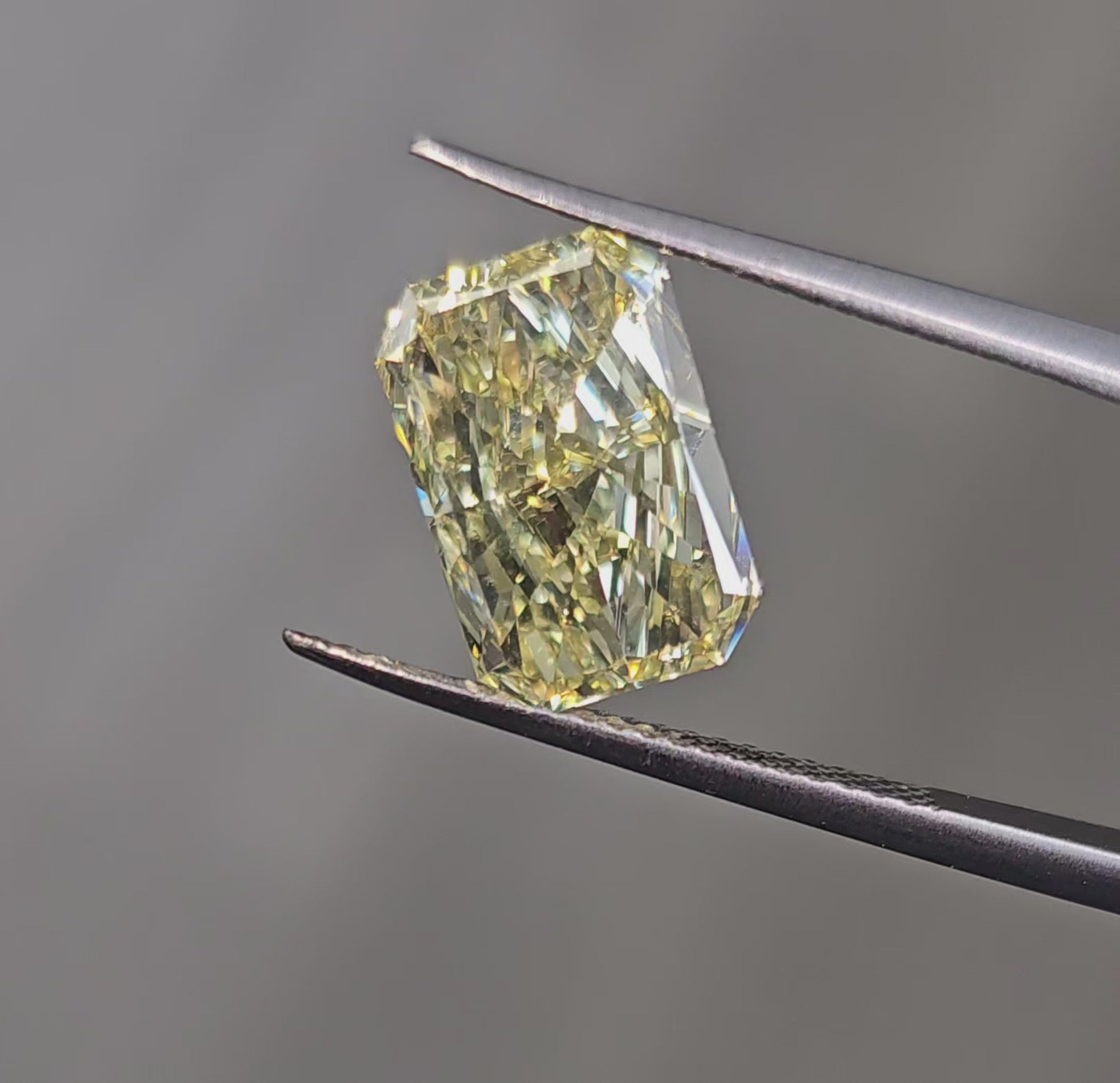 Fancy yellow elongated radiant diamond with VVS2 clarity and excellent cut.