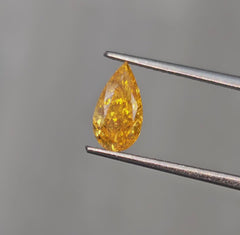Unique Radiant Orange-Yellow Pear Shaped Diamond.