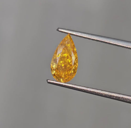 Unique Radiant Orange-Yellow Pear Shaped Diamond.