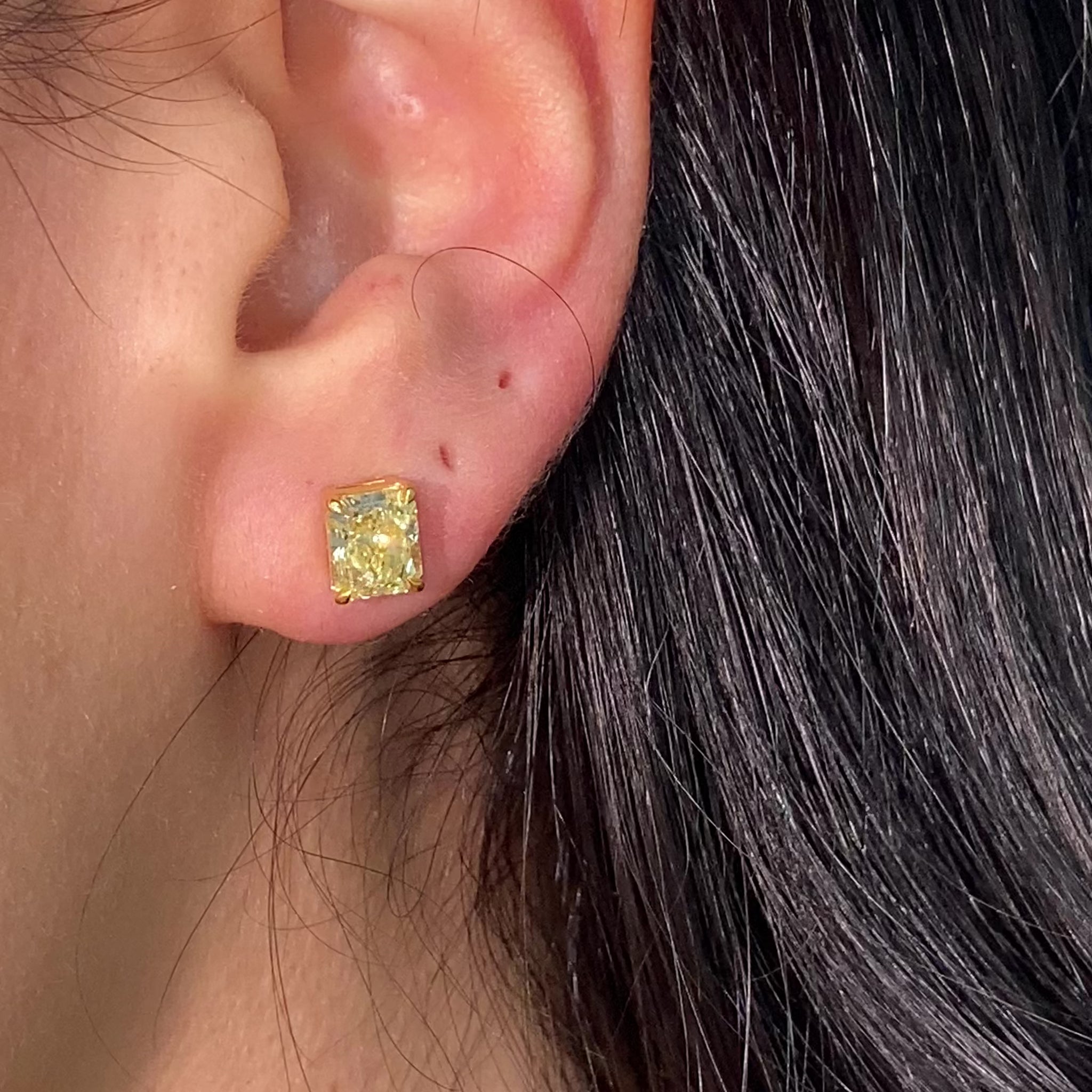 GIA certified fancy yellow diamond studs radiant video
