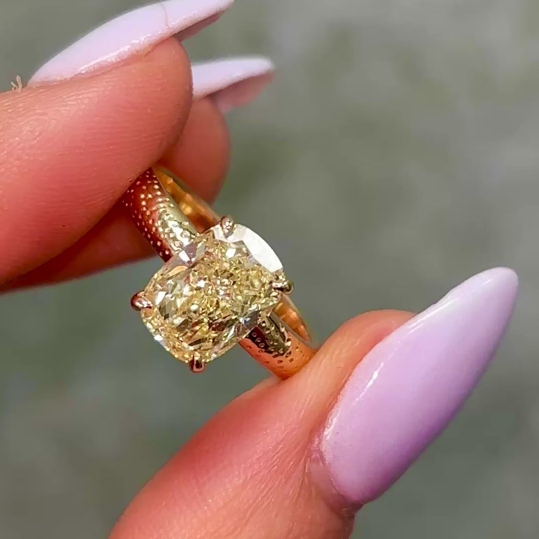 Gold ring with a yellow diamond elgated cushion 3 carat video