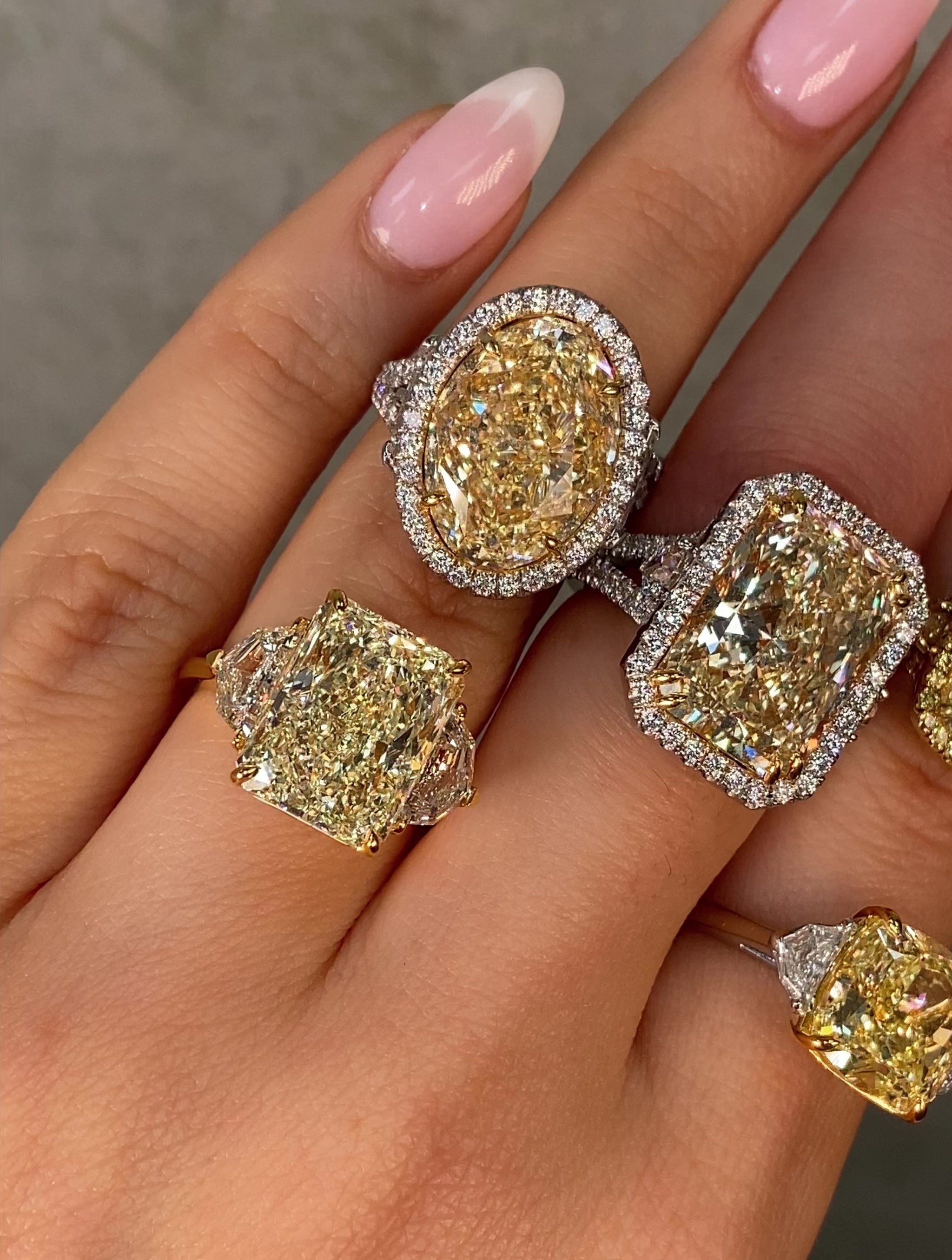 Video of five large yellow diamond rings