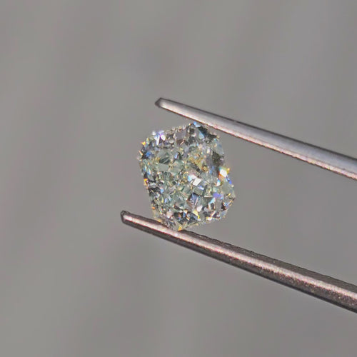 Elegant GIA certified light bluish green radiant cut diamond with captivating SI2 clarity.