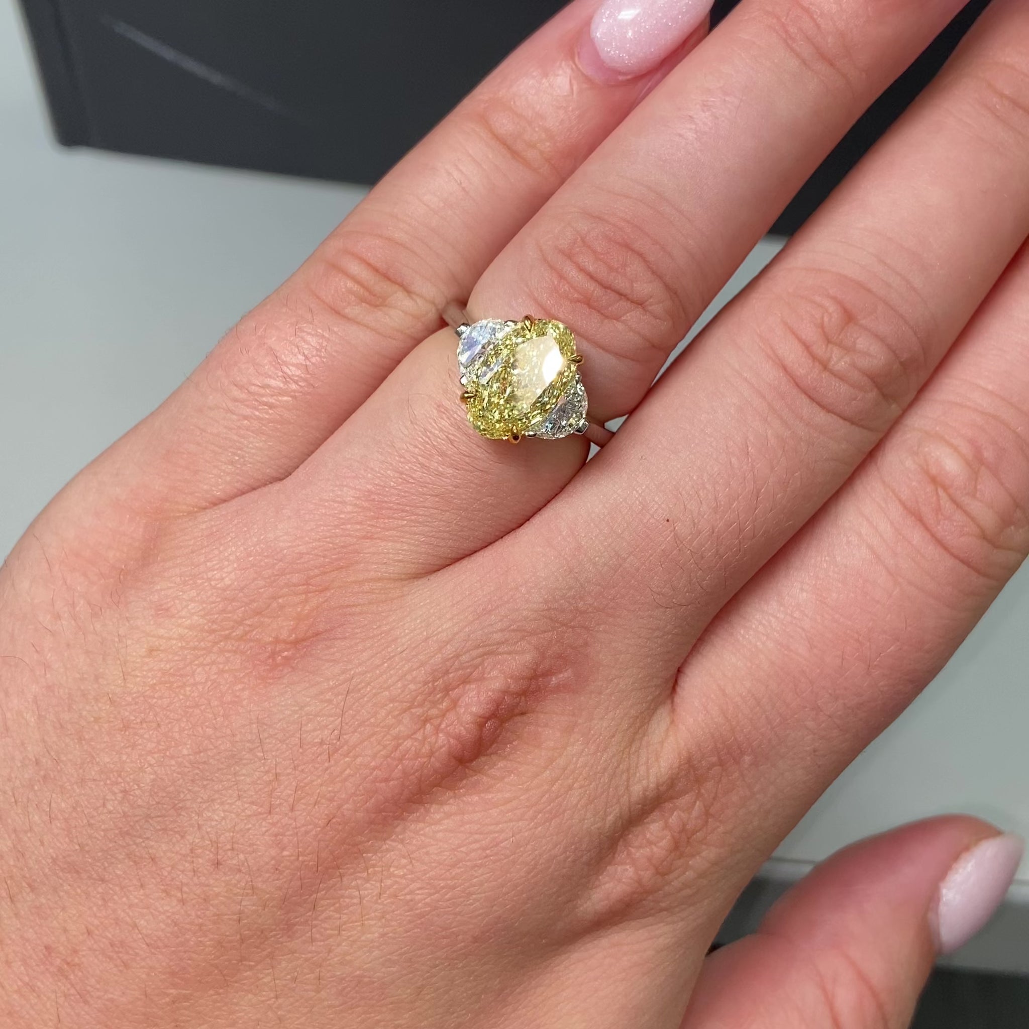 3ct Fancy intense Yellow Oval Three Stone Diamond Ring, a canary oval diamond.