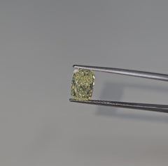 GIA certified light yellow elongated cushion cut diamond with VVS1 clarity.