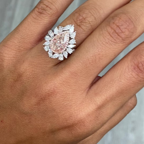 Unique peach color diamond ring, pear shaped, GIA certified. 