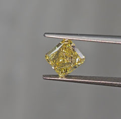 GIA certified Fancy Intense Yellow radiant cut diamond with SI1 clarity and vibrant color.